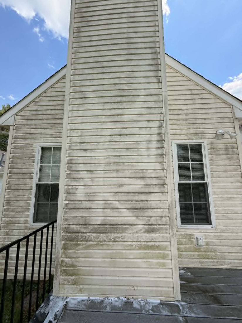 Chimney with heavy buildup before soft wash