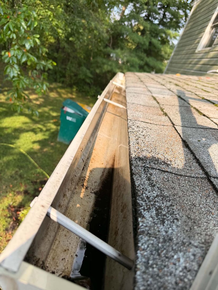 Same gutter cleared and flowing freely after cleaning