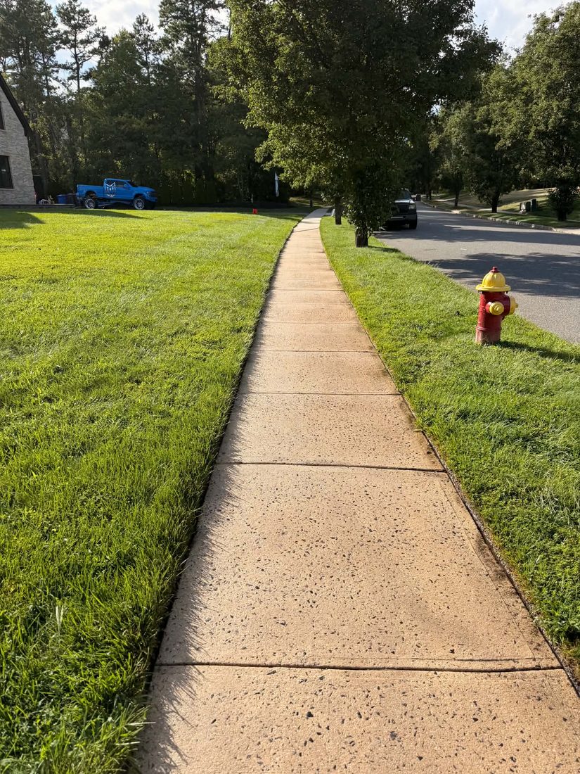 Finished concrete sidewalk after surface cleaning